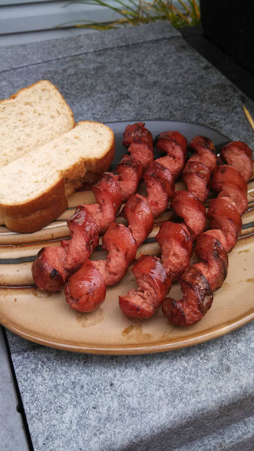 7. Slice hot dogs in a spiral for a more even cook.