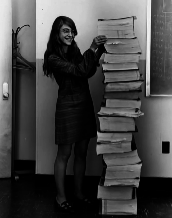 2. Margaret Hamilton proudly standing next to her code that leaded humanity to the moon
